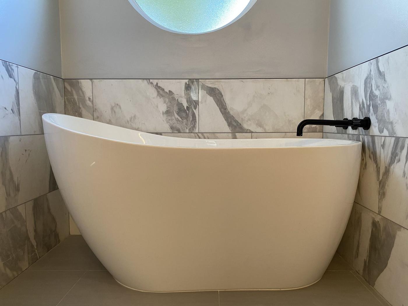 Freestanding soaking tub in a remodeled master bath